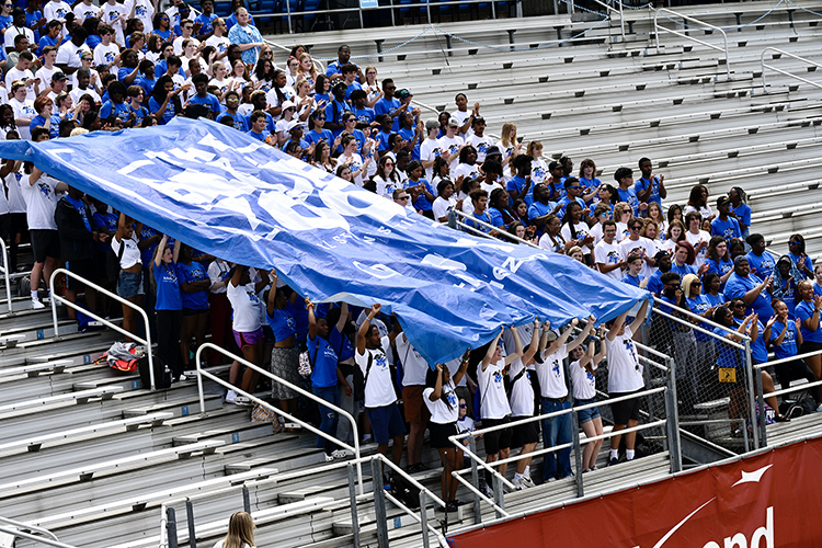 About 300 students from the Office of Student Success’ Scholars Academy and STAR early arrival programs help unfurl the Blue Zoo banner for the first time this academic year in the student section inside Floyd Stadium Wednesday, Aug. 17, as the MTSU fight song plays over the stadium speakers. (MTSU photo by J. Intintoli)