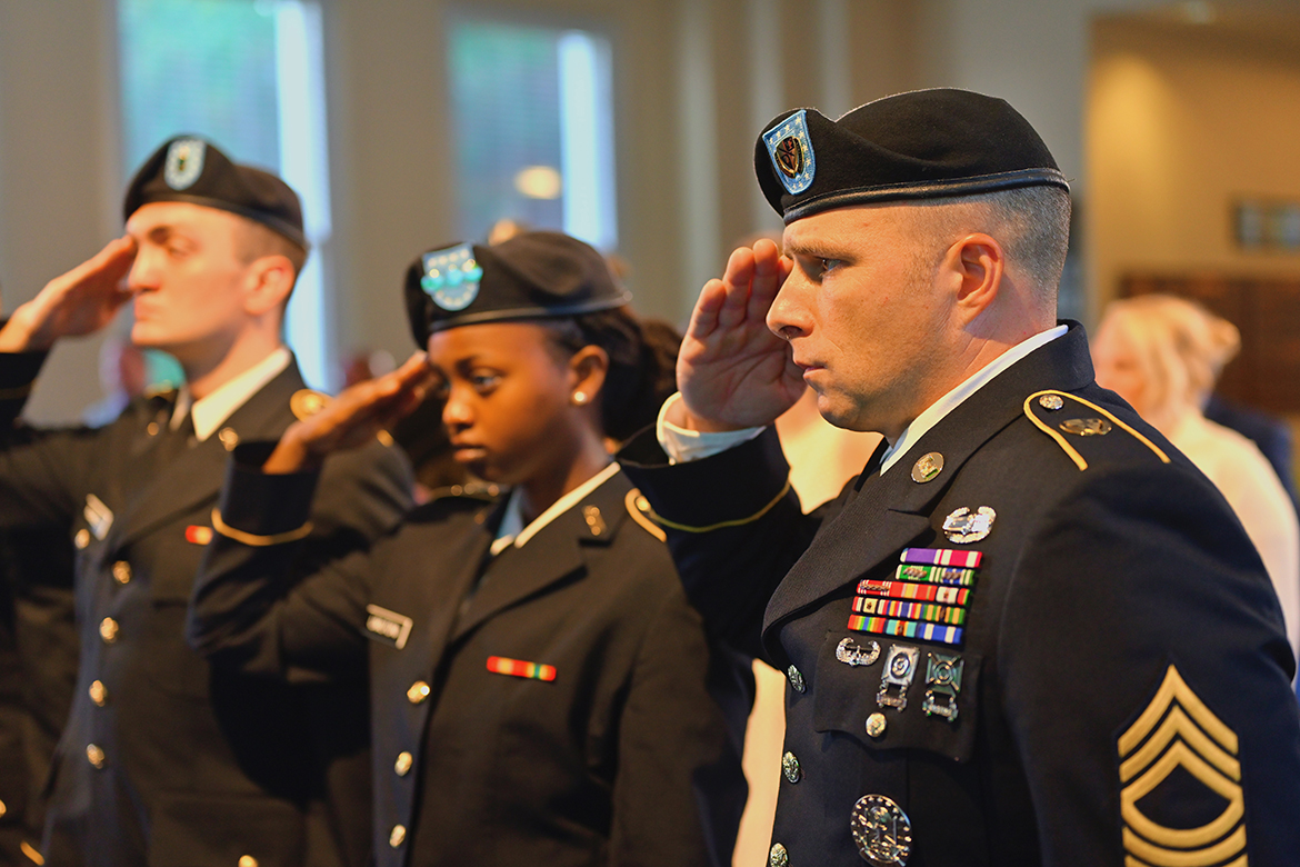 MTSU ROTC cadets Tyson Ramsey, left, and Uriella Umutoni and U.S. Army MSgt. James Bujnowski, senior military instructor in the Military Science Department, salute during the eighth annual 9/11 Remembrance at MTSU Sunday, Sept. 11, in the Tom H. Jackson Building's Cantrell Hall. (MTSU photo by Cat Curtis Murphy)