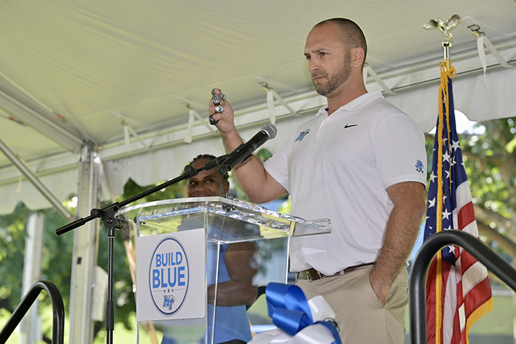 MTSU men's tennis coach Jimmy Borendame displays multiple conference title rings as evidence of the tennis program's progress Thursday, Sept. 15, at the groundbreaking ceremony for the Blue Raiders' new outdoor tennis complex to be built near the corner of Middle Tennessee Boulevard and Greenland Drive where the current outdoor courts are located. At left is MTSU women's tennis coach Tayo Bailey-Duvall. (MTSU photo by Andy Heidt)