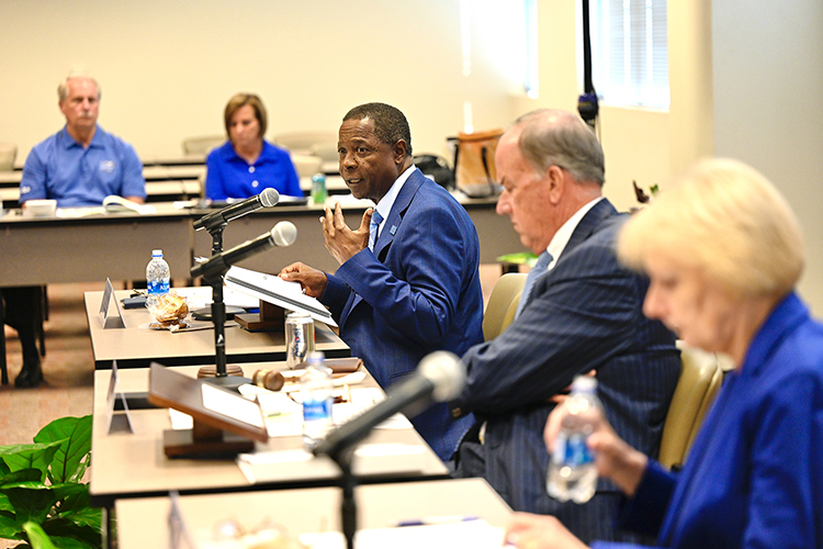 MTSU President Sidney A. McPhee, center, addresses the MTSU Board of Trustees during the Sept. 13 trustees meeting held at the Miller Education Center on Bell Street. At right is Board Chairman Stephen Smith and Vice Chairman Christine Karbowiak Vanek. (MTSU photo by J. Intintoli)