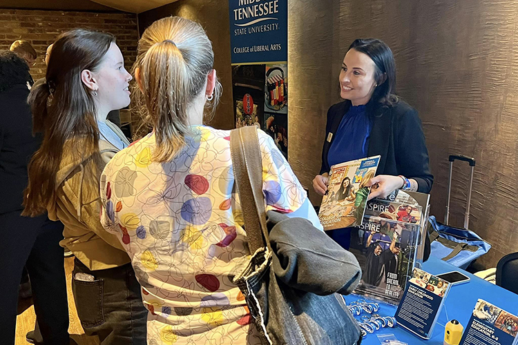 Alicia Abney, right, advising manager for the MTSU College of Education, talks to two prospective students attending the True Blue tour event Wednesday, Oct. 20, at The Foundry on the Fair Site in Knoxville, Tenn. (MTSU photo by Andrew Oppmann)