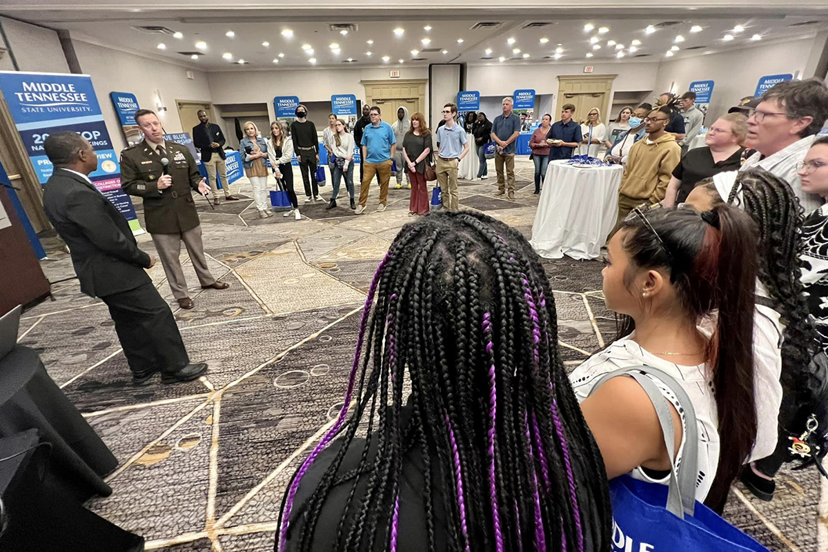 As MTSU President Sidney A. McPhee, left, listens, U.S. Army Lt. Col. Arlin Wilsher, second from left, talks with Birmingham, Ala., students attending the MTSU True Blue Tour recruiting event recently. Wilsher heads the MTSU Military Science Department. (MTSU photo by Andrew Oppmann)