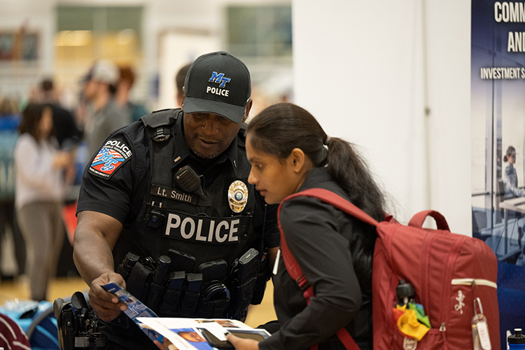 Middle Tennessee State University Police Lt. Demetrius Smith, left, speaks with a student during 2022 Fall Career Fair held Sept. 29 in the Campus Recreation Center. (MTSU photo by James Cessna)