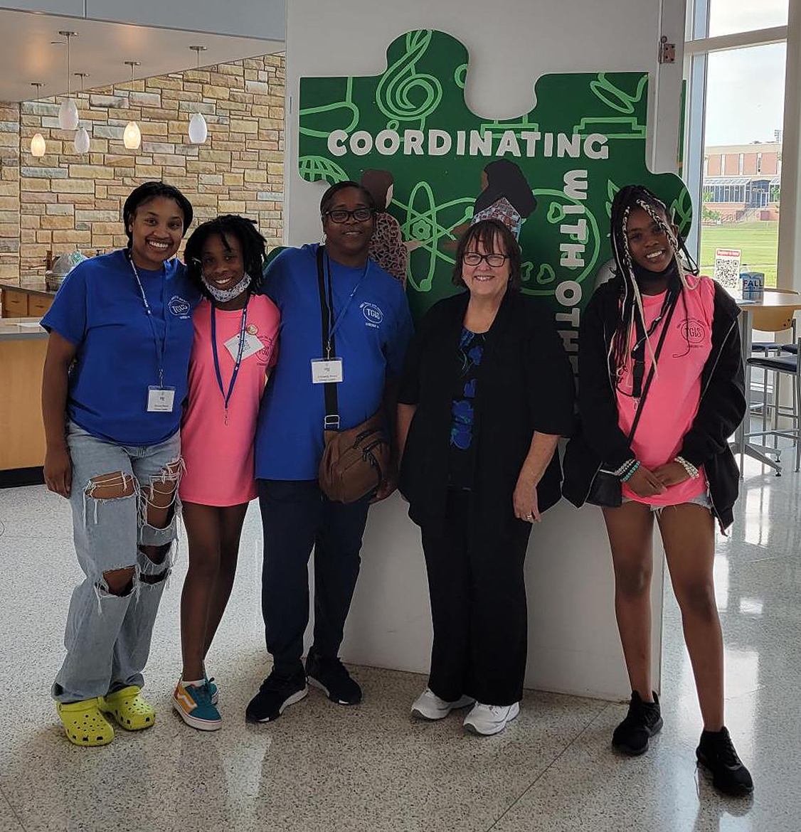 Heaven Moore, left, Tae’Yannah Moore, LaShanda Moore, Tennessee Girls in STEM conference Director Judith Iriarte-Gross and Kamareya Moore pose for a photo during the recent math and science conference in the Science Building and other campus facilities. (Submitted photo)