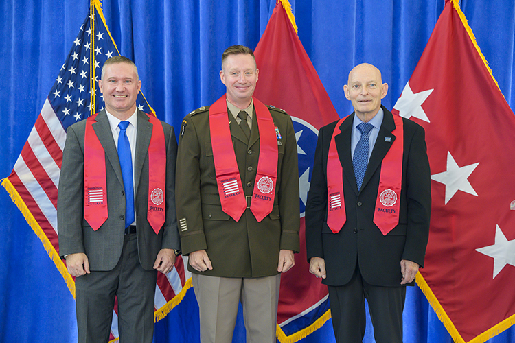 U.S. Army Lt. Col. Arlin Wilsher, center, professor in the Department of Military Science, wears his red stole received during the Faculty/Staff Stole Ceremony held Nov. 9 at the Miller Education Center. Pictured with him are retired Lt. Gen. Keith Huber, right, senior adviser for veterans and leadership initiatives, and Army veteran Lee Wade, ceremony speaker and interim associate dean for the College of Behavioral and Health Science. (MTSU photo by Andy Heidt)