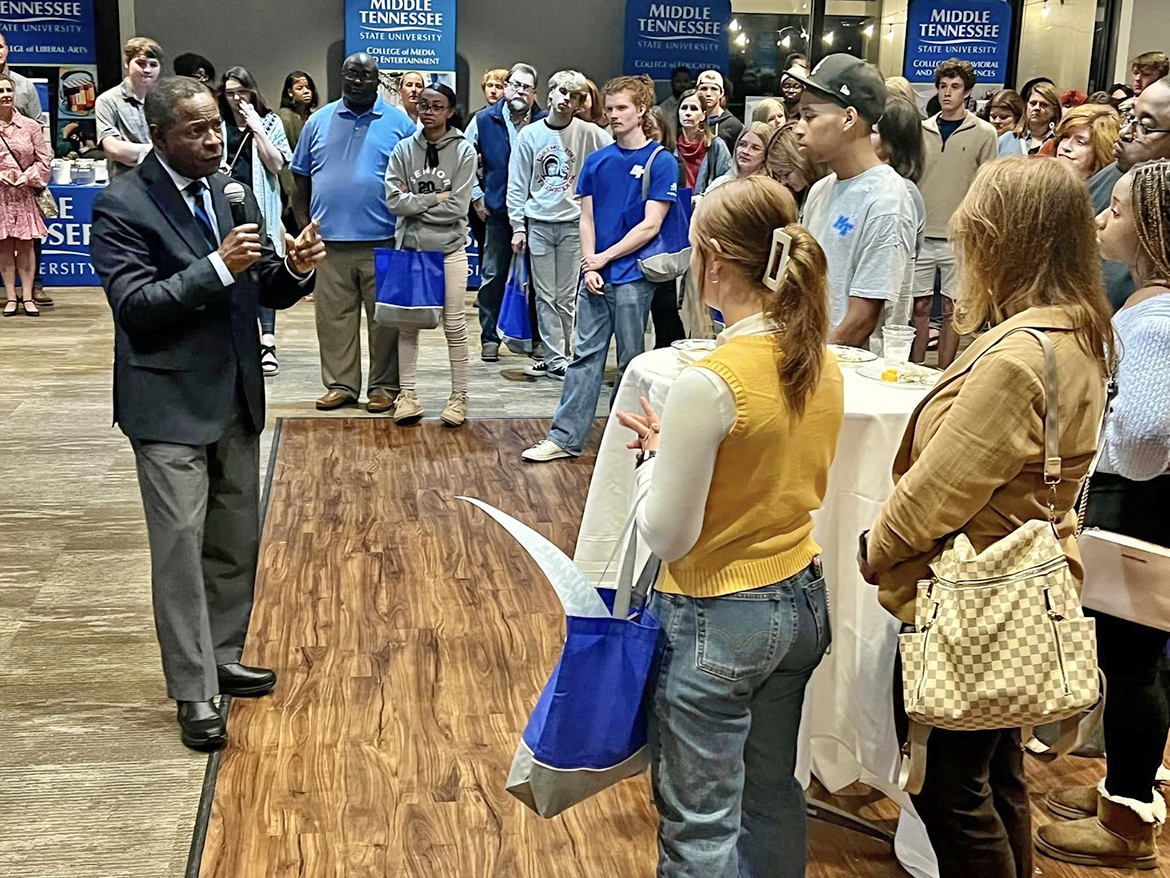 MTSU President Sidney A. McPhee, left, speaks to the crowd attending the Jackson True Blue Tour event at the Jackson Country Club in Jackson, Tenn., on Wednesday, Nov. 9. Prospective students and their parents learned about MTSU academic programs, scholarships, facilities, housing, student success and more during the two-hour program that featured special prizes and scholarships. (MTSU photo by Andrew Oppmann)