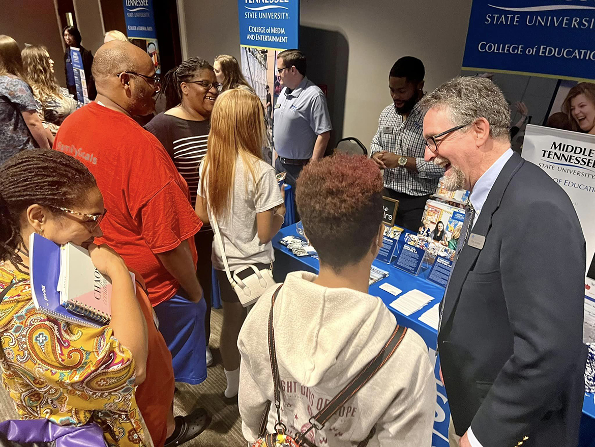 MTSU College of Education interim Dean Rick Vanosdoll, right, shares a laugh with a prospective student and parent Wednesday, Nov. 9, during the True Blue Tour recruiting event at the Jackson Country Club. All of MTSU’s deans, numerous advisors, Office of Admissions recruiters and other staff members provided information about the Murfreesboro university with the visitors.. (MTSU photo by Andrew Oppmann)