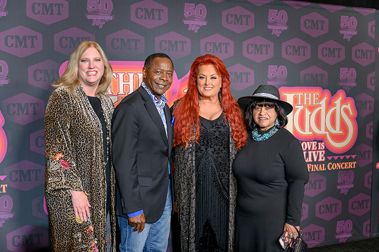 Wynonna Judd, center right, poses with Middle Tennessee State University President Sidney A. McPhee, center left, McPhee’s wife Elizabeth McPhee, right, and Dean of MTSU’s College of Media and Entertainment Beverly Keel at the red carpet for the “The Judds: Love is Alive – The Final Concert” event hosted at the Murphy Center on the university’s campus on Thursday, Nov. 3, 2022. (MTSU photo by James Cessna and Cat Curtis Murphy)