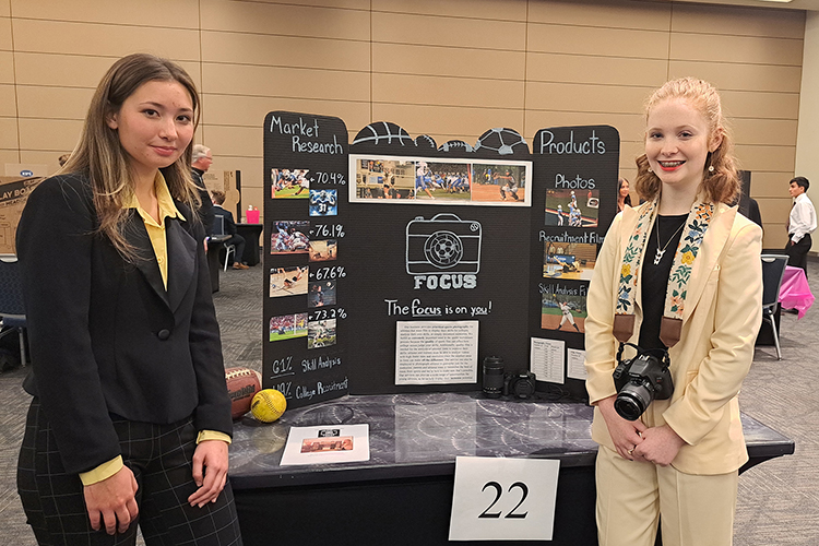 High school senior Ella Clark, left, and junior Katie Narrell of Murfreesboro’s Central Magnet School stand with their display for Focus Photography during MTSU’s seventh High School Entrepreneurship Fair held Nov. 16 in the Student Union Ballroom. The students earned the fifth place award for their business plan and presentation. (MTSU photo by James Cessna)