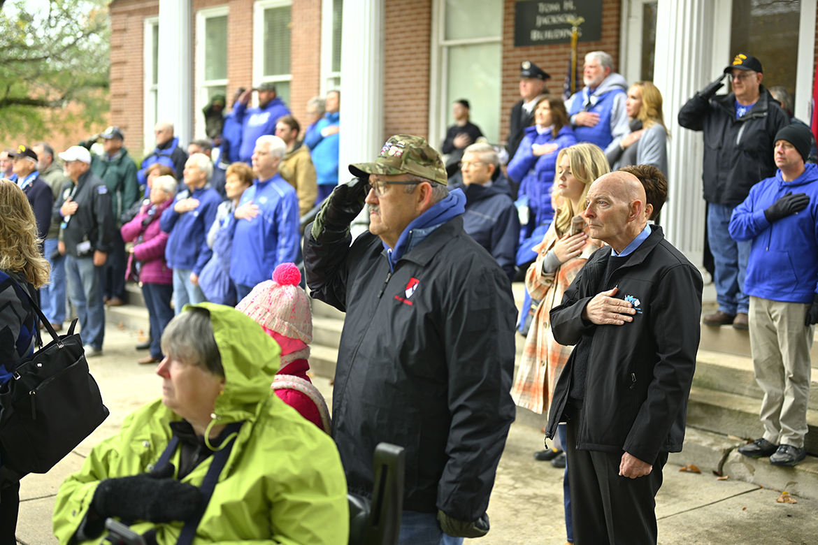 Veterans, including MTSU's Keith M. Huber, foreground right, listen to the playing of reveille during and early portion of the 40th annual Salute to Veterans and Armed Forces game's Memorial Service at the MTSU Veterans Memorial sight Saturday, Nov. 12. MT Athletics and the MTSU Charlie and Hazel Daniels Veterans and Military Family Center hosted a number of activities as part of the MT Blue Raider-Charlotte 49ers football game. (MTSU photo by Cat Curtis Murphy)