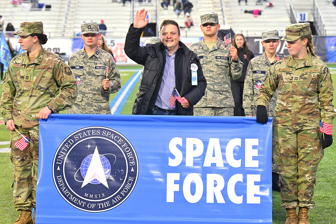 MTSU adjunct songwriting professor and Air Force veteran Jamie Teachenor, center, waves to the crowd Saturday, Nov. 12, as he represents the Space Force as part of MTSU’s 40th annual Salute to Armed Forces and Veterans football event at Floyd Stadium. He is joined by accompanied by MTSU Air Force ROTC cadets and cadets from the Smyrna squadron of Civil Air Patrol, the Air Force’s civilian auxiliary. Teachenor wrote the new Space Force anthem, “Sempre Supra,” which was played by MTSU’s Band of Blue for what is believed to be the first time by a marching band. (MTSU photo by Cat Curtis Murphy)