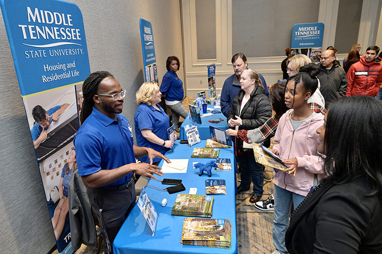 Prospective Middle Tennessee State University students and their families meet with staff at the Housing and Residential Life table to learn more about the Blue Raider campus at the university’s True Blue Tour event at the Cool Springs Marriott in Franklin, Tenn., on Monday, Nov. 14, 2022. (MTSU photo by Andy Heidt)
