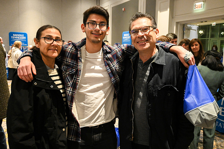 Prospective Middle Tennessee State University student Diego Torres, center, attended the university’s True Blue Tour event at the Cool Springs Marriott in Franklin, Tenn., on Monday, Nov. 14, 2022, with his parents Aida Torres, left, and Adan Torres to learn more about programs at the College of Media and Entertainment. (MTSU photo by Stephanie Wagner)
