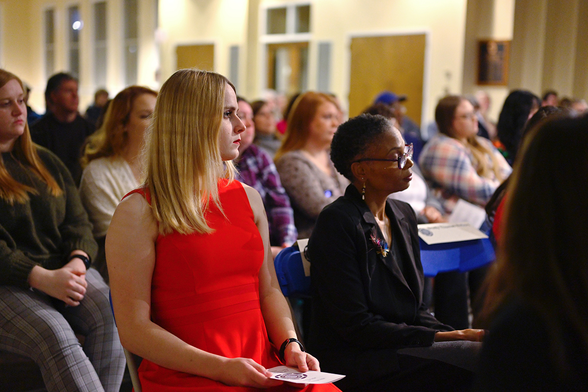Middle Tennessee State University College of Media and Entertainment students Micah Casey, left, and Johari Hamilton listen to presentations recently during the annual Honor Society of Phi Kappa Phi’s fall 2022 initiation at MTSU. The event, which featured more than 70 students and faculty combined being initiated into the organization along with three faculty members, was held in the Tom H. Jackson Building’s Cantrell Hall. (MTSU photo by Cat Curtis Murphy)