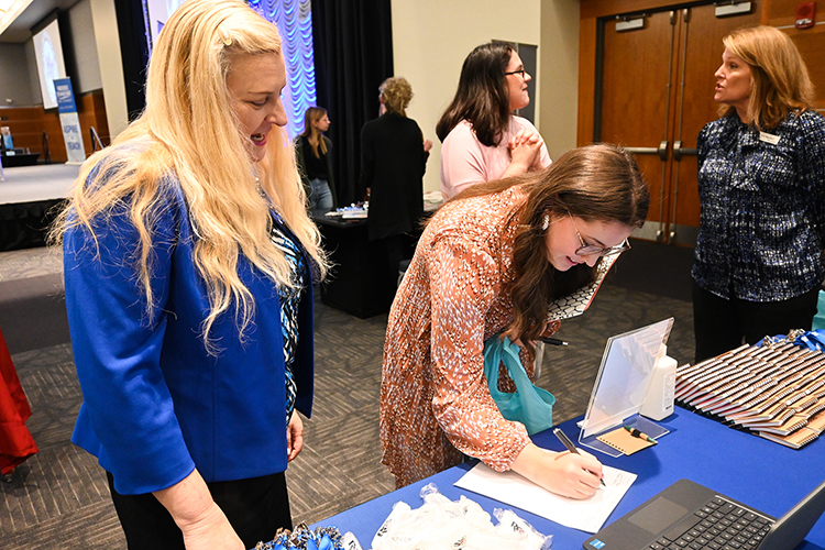 Andrea Anthony, left, assistant superintendent of human resources and support services at Rutherford County Schools, works to recruit a Middle Tennessee State University education graduate at the College of Education’s end-of-semester seminar at the Student Union Building on Thursday, Dec. 8, 2022. She complimented the high quality of MTSU-trained teachers. (MTSU photo by Stephanie Wagner)