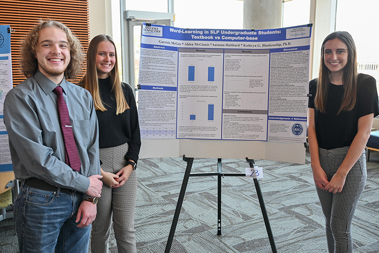 Middle Tennessee State University speech language pathology seniors Garrick McGee, left, Autumn Hubbard, center, and Alden McGinnis present their project about language acquisition at the Undergraduate Research Center’s open house event on Nov. 3, 2022, at the Science Building on campus. (MTSU photo by Stephanie Wagner)