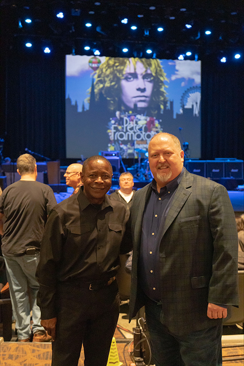 Middle Tennessee State University President Sidney A. McPhee, left, and Odie Blackman, associate professor of songwriting in MTSU’s College of Media and Entertainment, were among attendees at a special concert by legendary Grammy-winning rock artist Peter Frampton held Sunday, Jan. 22, at MTSU's Tucker Theatre. The free, made-for-TV concert will be aired on British television later this year. (Photo courtesy of Makayla Sulcer, MTSU Sidelines)