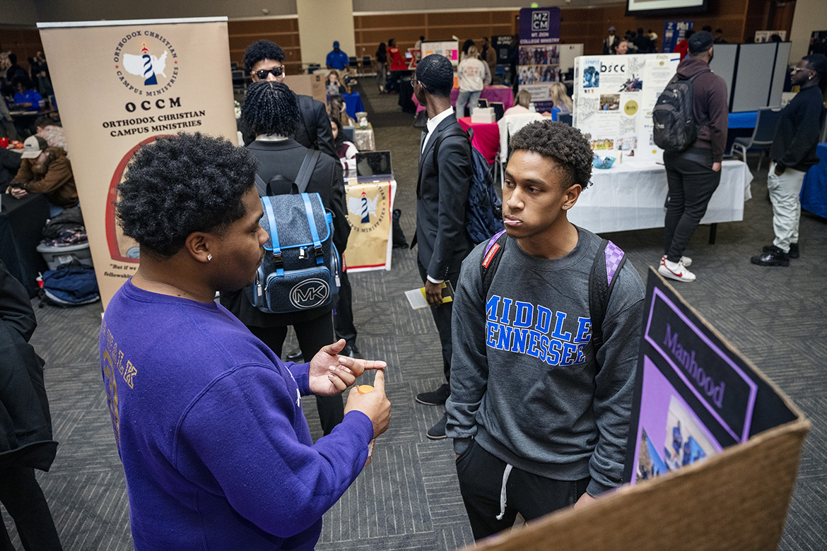Terrance Taylor Jr., right, a Middle Tennessee State University freshman video film production major from Humboldt, Tenn., listens as Courtland Wade, a senior nursing major from Trenton, Tenn., shares about his group recently during the 2023 spring Student Organization Fair in the Student Union Ballroom. Approximately 230 students attended the recent three-hour event. (MTSU photo by Andy Heidt)