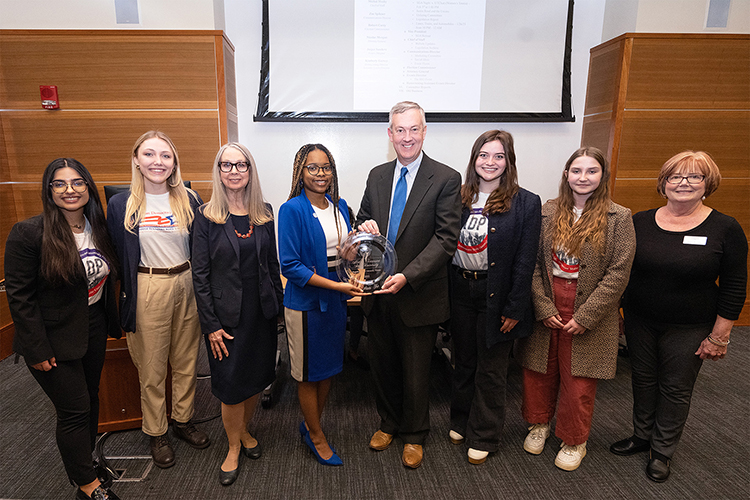 Tennessee Secretary of State Tre Hargett, center right, came to the Middle Tennessee State University campus on Thursday, Jan. 26, 2023, to present Student Government Association President Jada Powell, center left, with the award for the university winning his College Voter Registration Competition for the second time. Pictured with them, from left, the Student Union Parliamentary Room are students and members of the MTSU chapter of the American Democracy Project Elaf Alkazzaz, and Kayla Jenkins, professor and ADP coordinator Mary Evins, Powell, Hargett, ADP President and student Stevie Naumcheff, ADP member and student Victoria Grigsby and ADP board member and professor Laura Clark. (MTSU photo by Cat Curtis Murphy).