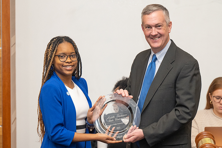 Tennessee Secretary of State Tre Hargett, right, presents Jada Powell, Middle Tennessee State University student and president of the Student Government Association, with the award for the university’s second win of his College Voter Registration Competition on Thursday, Jan. 26, 2023, at the Student Union Parliamentary Room on campus. (MTSU photo by Cat Curtis Murphy).