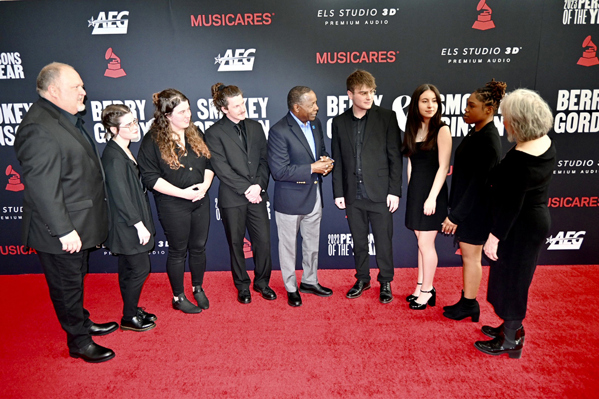 Middle Tennessee State University President Sidney A. McPhee, center, chats with students and faculty on the red carpet Friday, Feb. 3, at the exclusive MusiCares event honoring Motown founder Berry Gordy and Grammy-winning musical giant Smokey Robinson. At far left is Odie Blackmon, songwriting associate professor, and at far right is recording industry assistant professor Denise Shackelford. Students worked behind-the-scenes at the Los Angeles Convention Center at the event, the Grammy’s black-tie fundraiser for its charity that provides health and human services for music professionals. (MTSU photo by Andrew Oppmann)