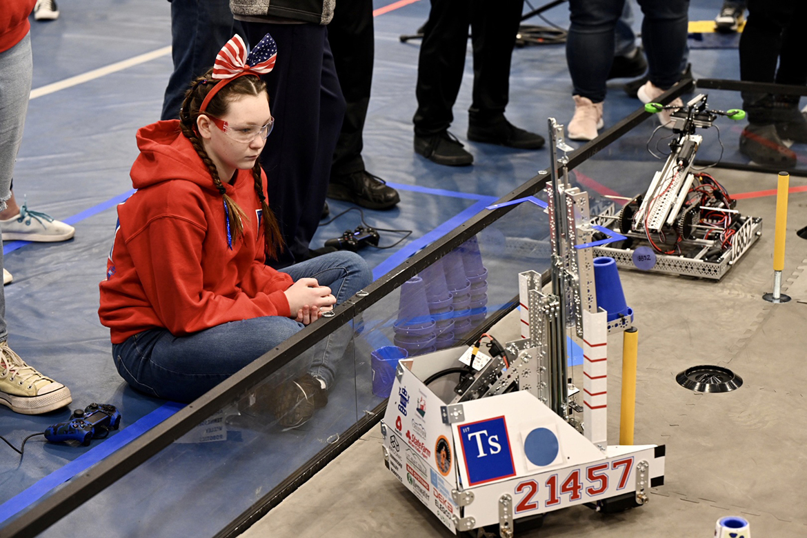 A team member for the Tennesine Titans of Maryville, Tenn., watches as their robot, “Titus,” maneuvers during an early-round match during the TNFIRST First Tech Challenge Tennessee State Championship in robotics on Saturday, Feb. 18, at Middle Tennessee State University’s Alumni Memorial Gym. (MTSU photo by James Cessna)