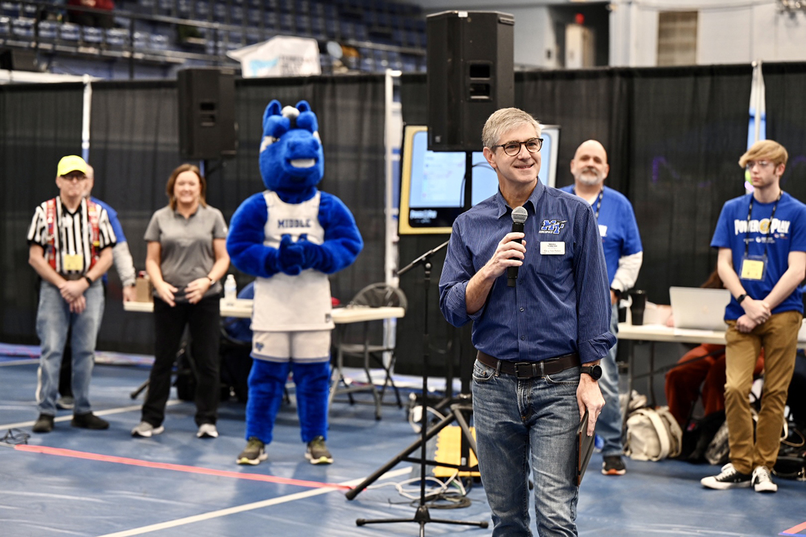 Greg Van Patten, dean for the Middle Tennessee State University College of Basic and Applied Sciences, welcomes participating teams and visitors to the annual TNFIRST First Tech Challenge Tennessee State Championship in robotics on Saturday, Feb. 18, in MTSU’s Alumni Memorial Gym. He urged competitors to have fun and understand they can eventually be financially rewarded with this same team-based problem-solving by following an engineering pathway. (MTSU photo by James Cessna)