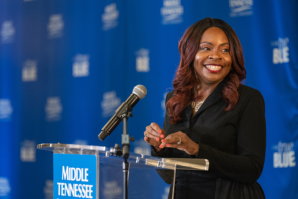 MTSU Health and Human Performance professor Chandra Russell Story is all smiles after being introduced as the 2023 John Pleas Faculty Recognition Award recipient during a special ceremony Tuesday, Feb. 21, at the Ingram Building’s MT Center. (MTSU photo by Cat Curtis Murphy)