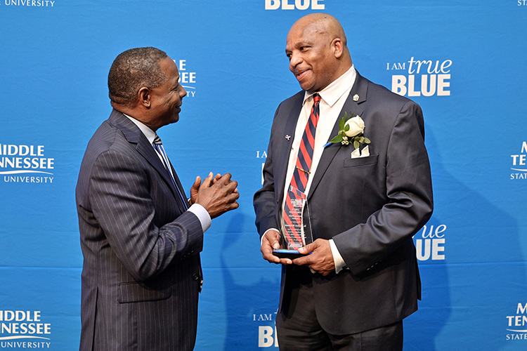 Middle Tennessee State University President Sidney A. McPhee, left, congratulates alumnus Michael McDonald for being recipient of the “unsung hero” award as an advocate for civility at the 27th annual Unity Luncheon held Wednesday, Feb. 8, at the Student Union Building. (MTSU photo by Andy Heidt)