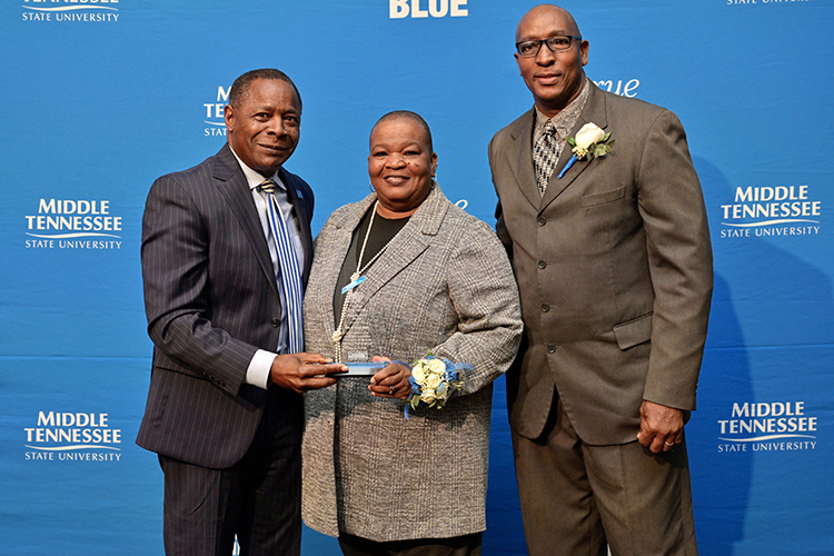 Middle Tennessee State University President Sidney A. McPhee, left, presents alumni Sybil and Joe Rich with the “unsung hero” award for community service at the 27th annual Unity Luncheon held Wednesday, Feb. 8, at the Student Union Building. (MTSU photo by Andy Heidt)