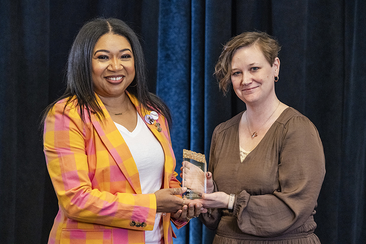 Christina Cobb, left, an assistant professor in the University Studies Department, is presented a 2023 MTSU Trailblazer Award by Maigan Wipfli, director of the June Anderson Center for Women and Nontraditional Students, at the March 1 kickoff for National Women’s History Month at the Ingram Building’s MT Center at Middle Tennessee State University. (MTSU photo by Andy Heidt)