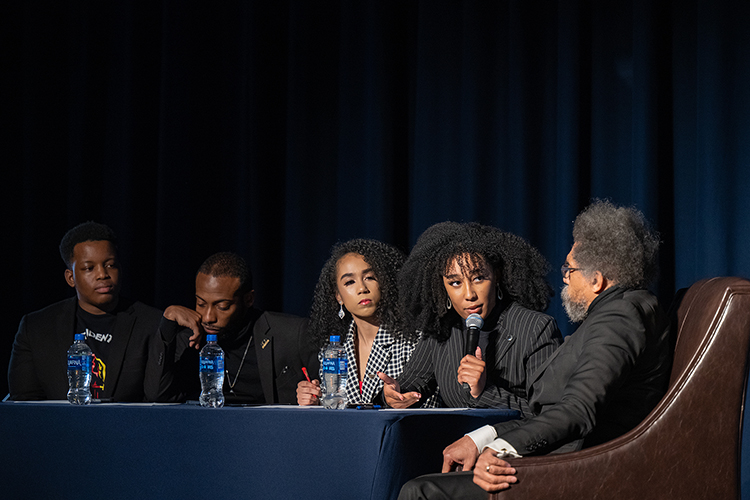 MTSU student moderator Alandra McMillan poses a question to author and philosopher Cornel West, far right, during the fourth “State of the African American Union” address held Friday, Feb. 24, in the Tennessee Room of the James Union Building at Middle Tennessee State University in Murfreesboro, Tenn. Shown with them on stage, from left, are student moderators Tobias Gurley, Shane Hinton and Paige Jackson. (MTSU photo by Cat Curtis Murphy)