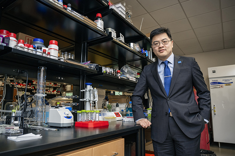 Mike Zhang, Middle Tennessee State University assistant professor and researcher, poses for a photo in his lab on Friday, Feb. 24, 2023, in the Science Building where he works on one of his three concurrent chemistry research projects. (MTSU photo by Andy Heidt)