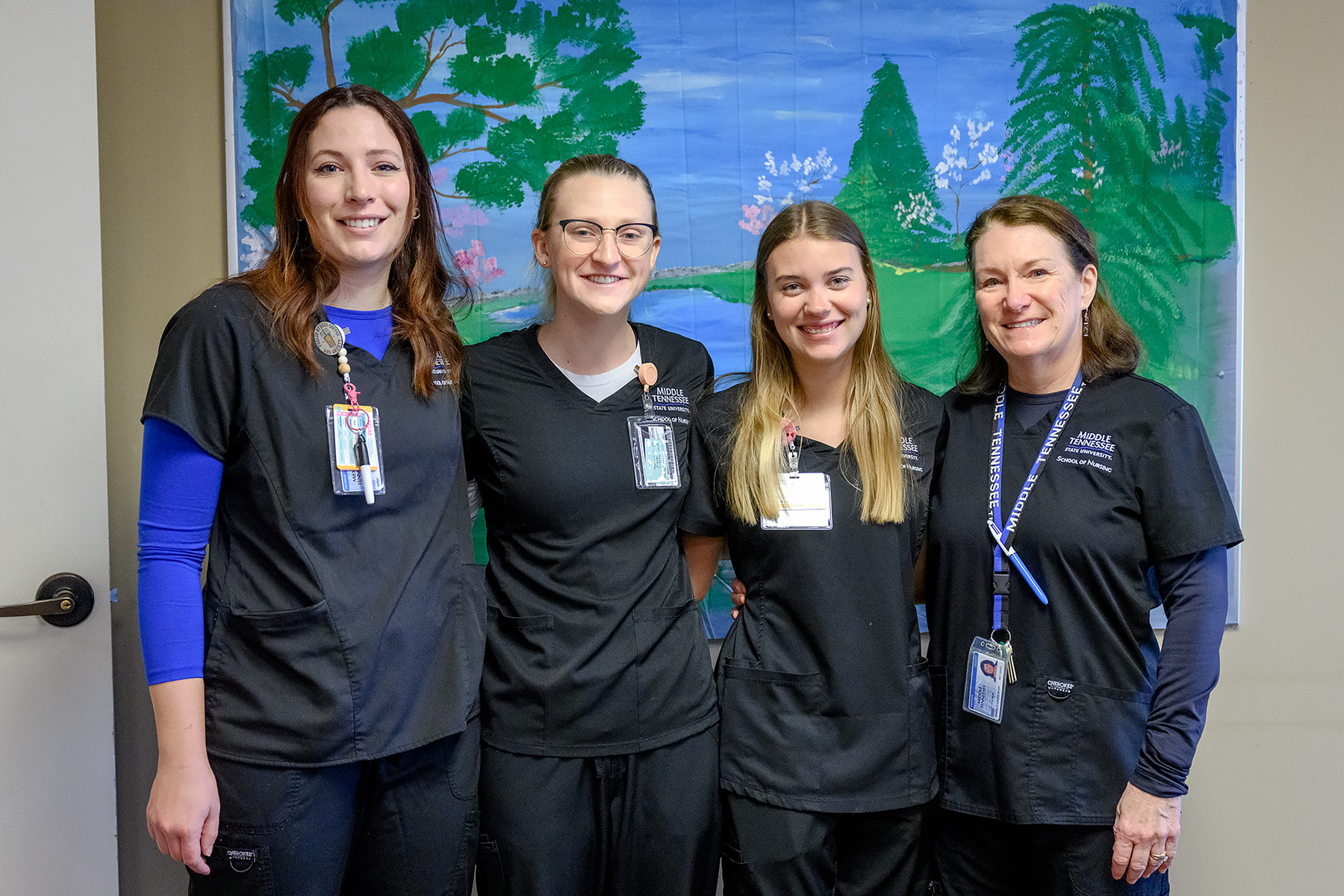 Middle Tennessee State University nursing students, from left, Kaitlyn Beckstead, Barbara Frizzell and Insa Feldhusen pose for a photo with their nursing professor, Shelley Moore, far right, while completing the final hours of their hands-on experience at local Mindful Care adult day program as part of a new partnership between the nonprofit and students in the School of Nursing’s Health and Gerontology course on March 13, 2023, in Murfreesboro, Tenn. (MTSU photo by J. Intintoli)