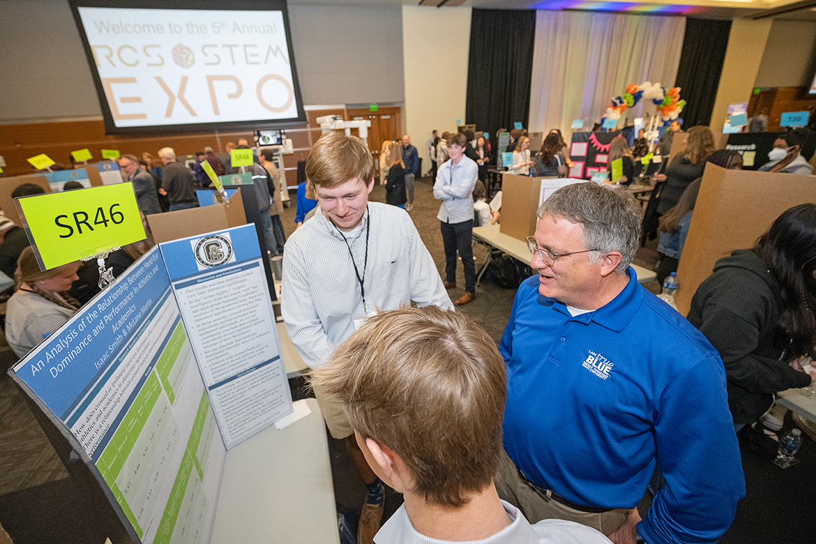 Middle Tennessee State University Provost Mark Byrnes, right, admires the creativity of the STEM project conducted by Central Magnet School students Isaac Smith, left, and McLane Martin recently during the fifth annual Rutherford County Schools’ STEM Expo in the MTSU Student Union Ballroom. Smith, who has received a Presidential Scholarship, plans to attend MTSU this fall and major in biochemistry on a premed pathway. (MTSU photo by Cat Curtis Murphy)