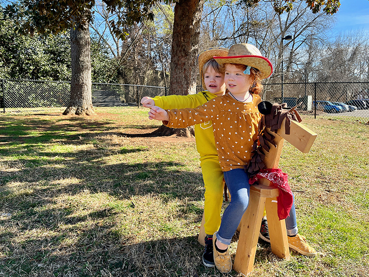 Two of the little learners at MTSU's Ann Campbell Early Learning Center ride away on their pretend pony while playing in the center’s playground in this February photo. The nonprofit, inclusive preschool, an arm of MTSU’s College of Education, is celebrating 40 years of service by welcoming supporters of all ages to its 16th annual "Saddle Up" fundraiser on Saturday, April 15. For more information, visit https://www.mtsu.edu/acelearningcenter/saddleup.php. (Photo courtesy of the Ann Campbell Early Learning Center at MTSU)