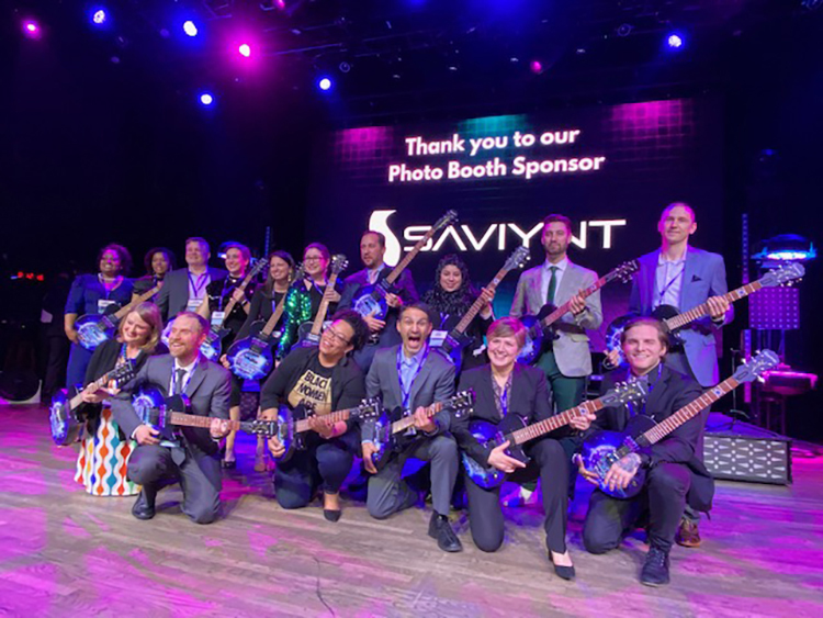 Sam Zaza, back row, third from right, assistant professor in the MTSU Department of Information Systems and Analytics, holds the guitar award with fellow award recipients at the Greater Nashville Technology Council’s awards ceremony held Feb. 16 at the Wildhorse Saloon in Nashville, Tenn. Zaza was named the NTC’s Diversity and Inclusion Advocate of the Year. (Submitted photo)