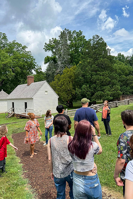 Katie Crawford-Lackey, alumna of Middle Tennessee State University’s Public History Ph.D. program, third from right in an orange shirt, gives a tour of founding father James Madison’s estate Montpelier in Virginia in the fall of 2022, where she works as director of the Robert H. Smith Center for the Constitution. Crawford-Lackey and her colleagues recently won a President’s Award from the local Culpeper NAACP chapter for their work on maintaining structural parity on the foundation’s board for the Montpelier Descendants Committee, made up of the descendants of people enslaved at Montpelier and nearby plantations. (Photo courtesy of Katie Crawford-Lackey)