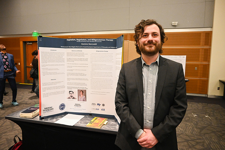 Dominic Marcoaldi, Middle Tennessee State University philosophy and religion senior, investigated the connection between the philosophy of language and communication as part of MTSU’s 17th annual Scholars Week student research and creative activity exposition on March 24, 2023, in the Student Union ballroom on campus. (MTSU photo by Stephanie Wagner)