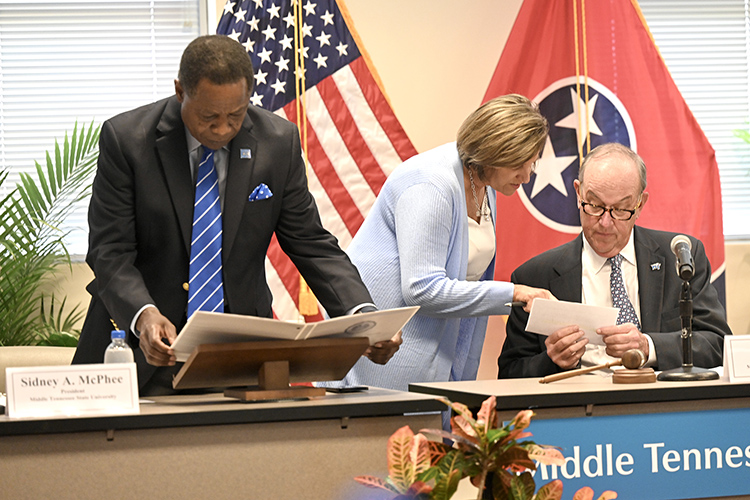 From left, MTSU President Sidney A. McPhee, Kimberly Edgar, his chief of staff and executive assistant, and Board of Trustees Chairman Stephen Smith prepare for the board’s quarterly meeting Tuesday, April 4, 2023, in the Miller Education Center on Bell Street in Murfreesboro, Tenn. (MTSU photo by J. Intintoli)