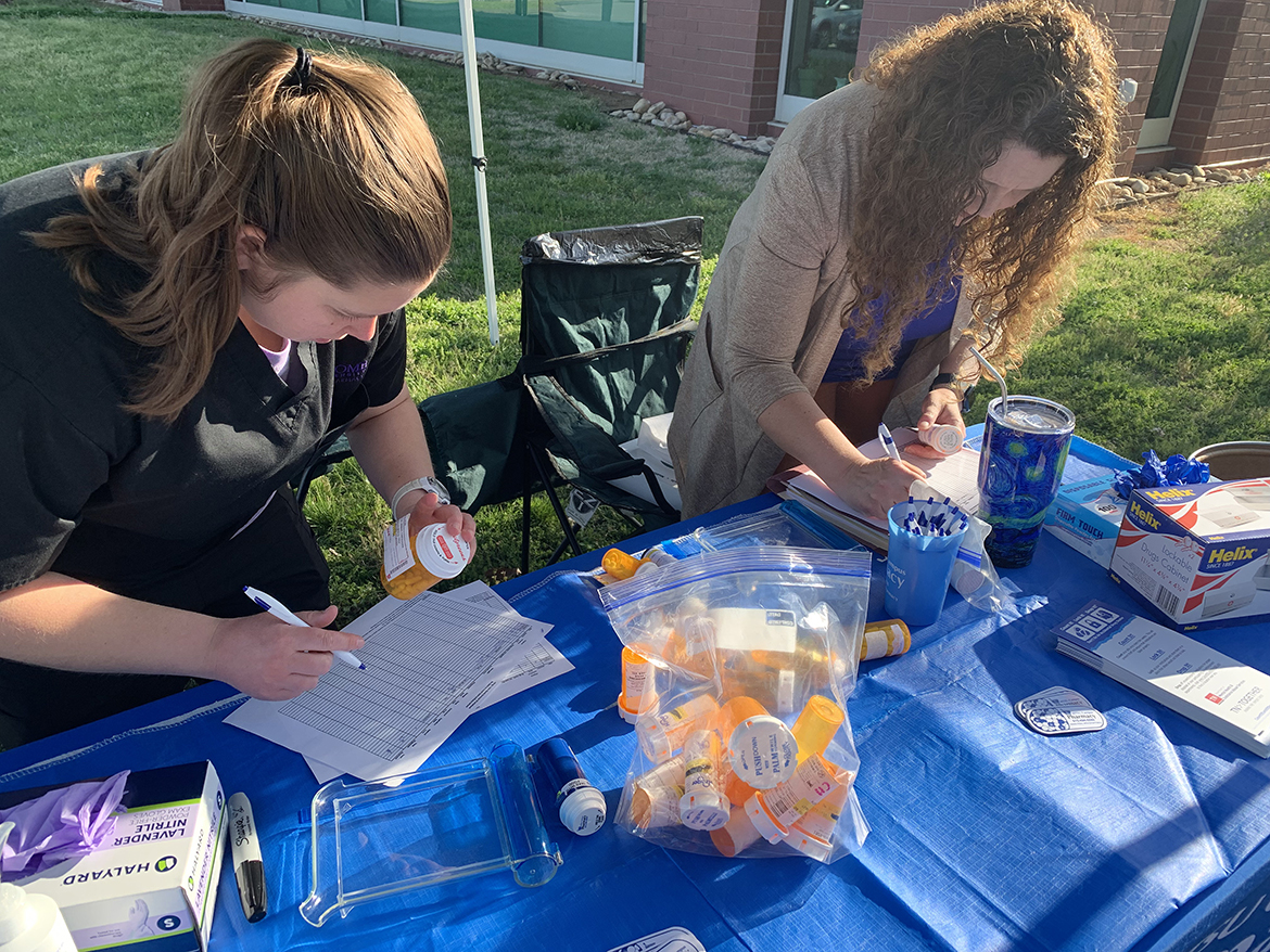 Fourth-year Lipscomb University College of Pharmacy student Lindsey McInturff, left, of Nashville, Tennessee, and Middle Tennessee State University Campus Pharmacy pharmacist Tabby Ragland document the expired and unwanted over-the-counter, prescription and other medications, vitamins and pet medications dropped off by campus and community members Tuesday, April 18, during the spring MTSU Drug Take-Back Day. The event was held near the Campus Pharmacy drive-thru outside the Health, Wellness and Recreation Center, and netted nearly 54 pounds of contributed items. (MTSU photo by Randy Weiler)
