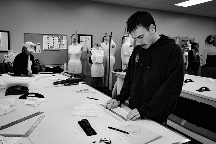 Middle Tennessee State University students Elijah Stern, right, and Shery Essa work on their senior fashion design collections as part of the Patternmaking 2 course on March 29, 2023, at the McWherter Learning Resources Center on campus in preparation for the student-led runway show slated for Saturday, April 15, at 5 p.m. at the Miller Education Center on Bell Street. (MTSU photo courtesy of Katy Dorey)