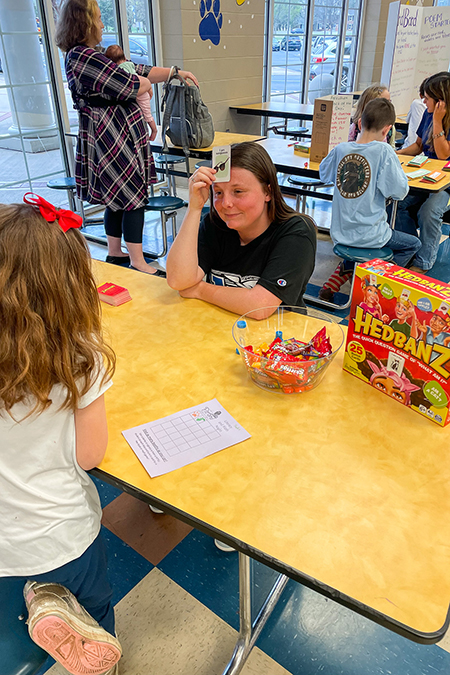 Children play games at a math and literacy family night event at John Pittard Elementary in Murfreesboro, Tenn., on March 23, 2023, co-organized by faculty and students from Middle Tennessee State University’s College of Education. (MTSU photo courtesy of Katie Schrodt)