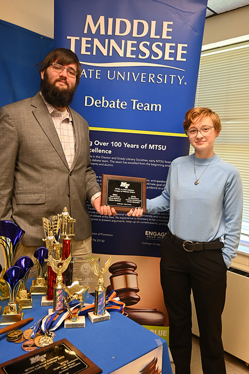 Blue Raider Debate members Derek Dismukes, a spring graduate in criminal justice administration and pre-law minor, and Elliot Certain, a rising senior social work major with an honors minor, are pictured in Jones Hall at Middle Tennessee State University holding a commemorative plaque of the spring 2023 debate with the Irish Times National Debate Champions held in Brentwood, Tenn. (MTSU photo by Jimmy Hart)
