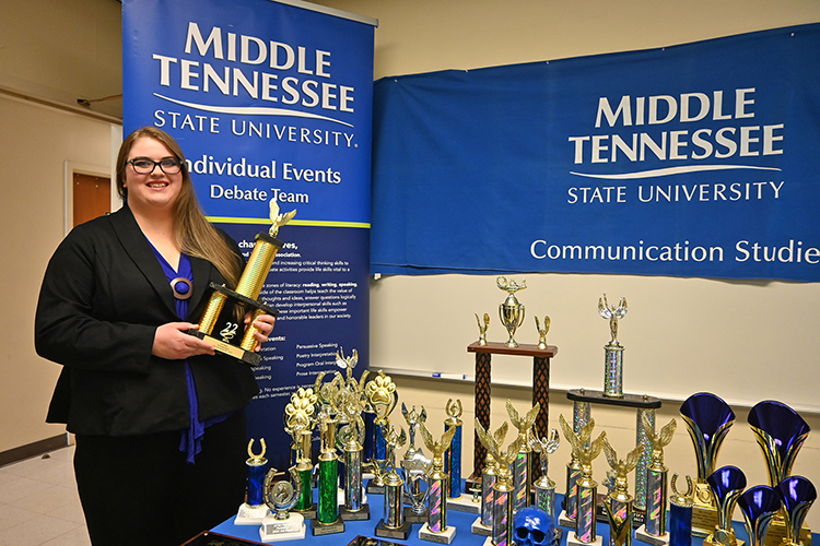 Blue Raider Debate member and rising senior Jessica Rogers, a psychology and communication studies major, is shown inside Jones Hall at Middle Tennessee State University with the sweepstakes award she captured by herself at the Hub City Swing tournament at the University of Southern Mississippi during the 2022-23 debate season. (MTSU photo by Jimmy Hart)