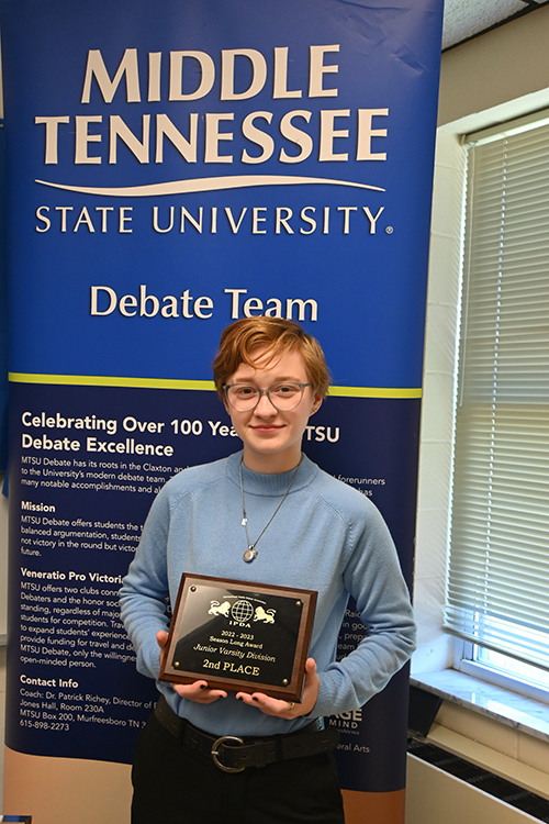 Blue Raider Debate member Elliot Certain, a rising senior social work major with an honors minor, is shown inside Jones Hall at Middle Tennessee State University holding the second-place, season-long junior varsity division plaque from the International Public Debate Association that he captured during the 2022-23 debate season. (MTSU photo by Jimmy Hart)