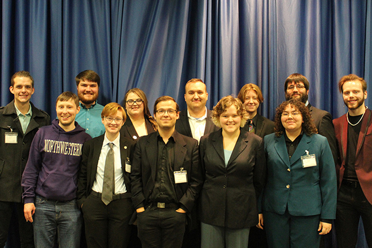 Members of the Blue Raider Debate Team pose for a photo at the International Public Debate Association National Tournament held in March in Boise, Idaho. Pictured, front row, from left, are alumnus Alex Fingeroot, a former national champion, and debate team members Elliot Certain, Graham Christophel, Link Williams and Marah Chance. Pictured back row, from left, are debate team members Ethan Schmidt, Jonny Locke, Jessica Rogers, Joey Mego, Lb Boardwine, Derek Dismukes and Steven Barhorst. (Submitted photo)