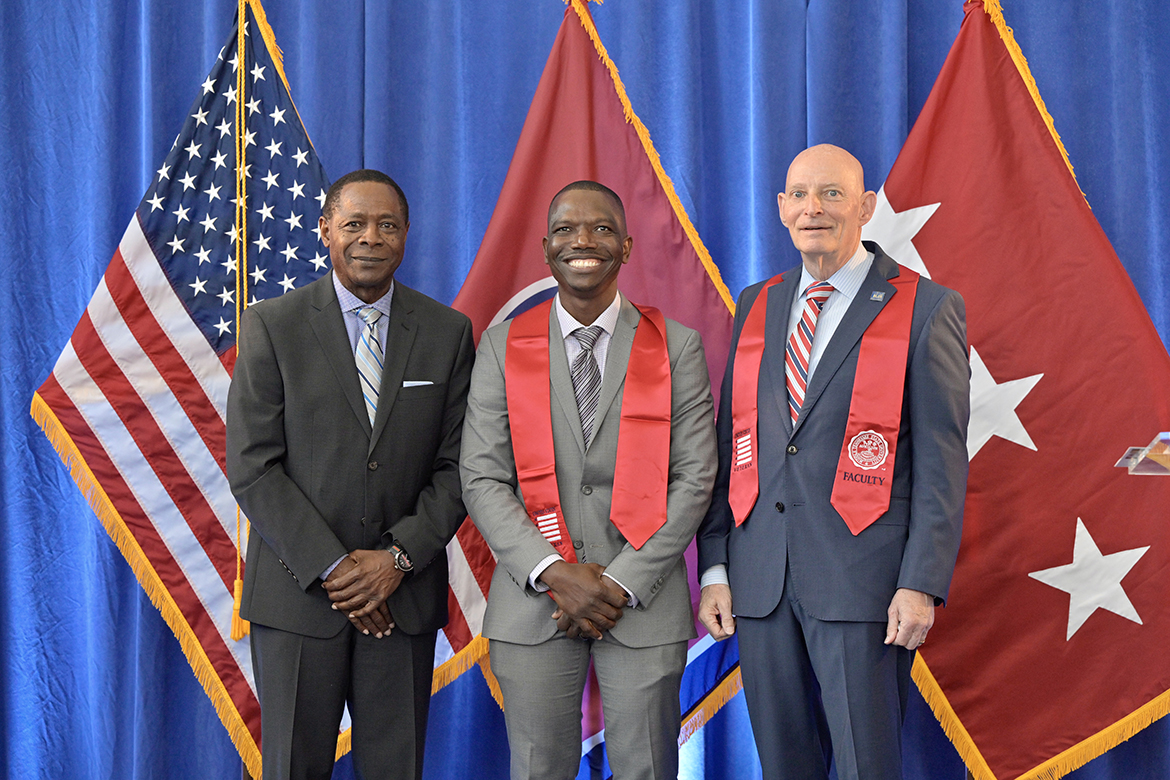 Middle Tennessee State University senior Kenel Saint Soir, center, receives congratulations from MTSU President Sidney A. McPhee, left, and retired U.S. Army Lt. Gen. Keith M. Huber, senior advisor for veterans and leadership initiatives, Wednesday, May 3, during the spring Graduating Veterans Stole Ceremony, held in the Miller Education Center’s second-floor atrium. Nearly 60 student veterans attended the ceremony where they are presented red stoles to wear at graduation May 5-6 in Murphy Center. (MTSU photo by Andy Heidt)