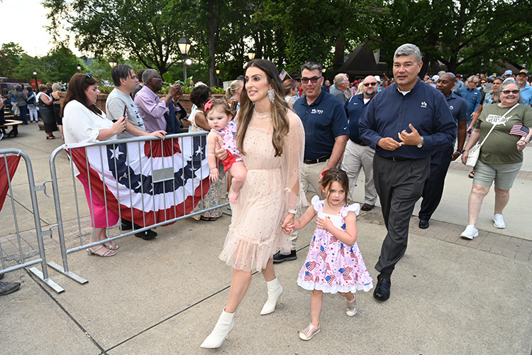 Air Force veteran Maranda Vecchio, a graduate student in the MTSU physician assistant program, takes part with her two daughters in the red carpet parade prior to the Grand Ole Opry Salutes the Troops event on Tuesday, May 23, in Nashville, Tenn. (MTSU photo by James Cessna)