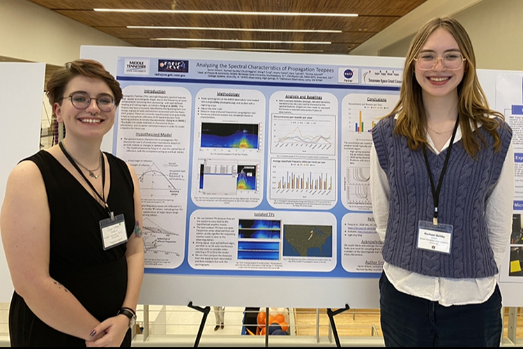 Rachel Quinby, a physics student at Middle Tennessee State University, right, is one of 11 MTSU undergraduates who was accepted to a prestigious National Science Foundation Research Experience for Undergraduates placement this summer. Quinby, pictured here presenting her research, will work on a physics research project at Vanderbilt University. (Photo courtesy of Rachel Quinby)